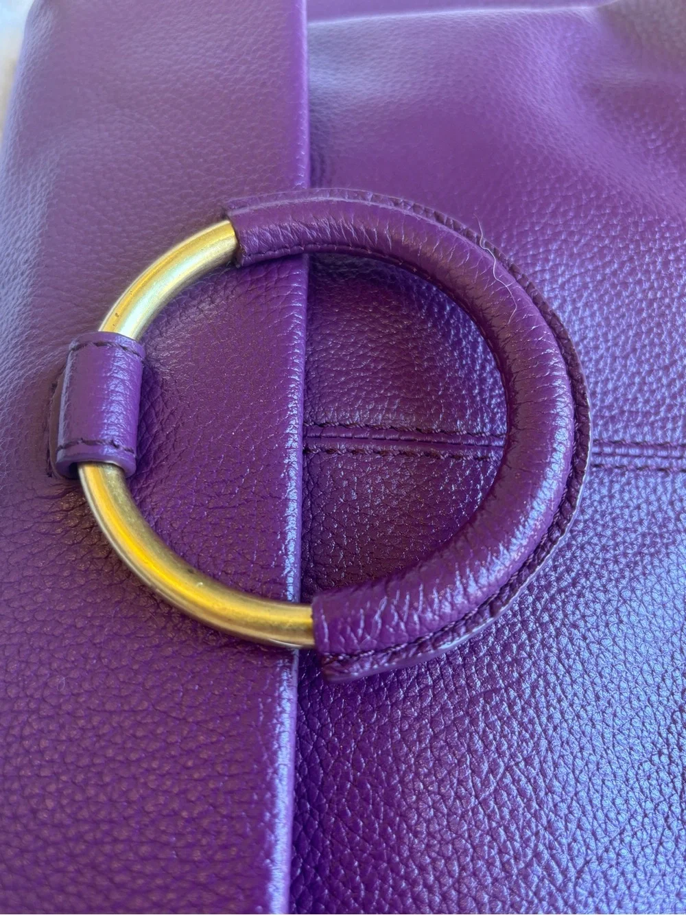 Vince Camuto pebbled purple leather Crossbody bag. Large gold ring hardware.